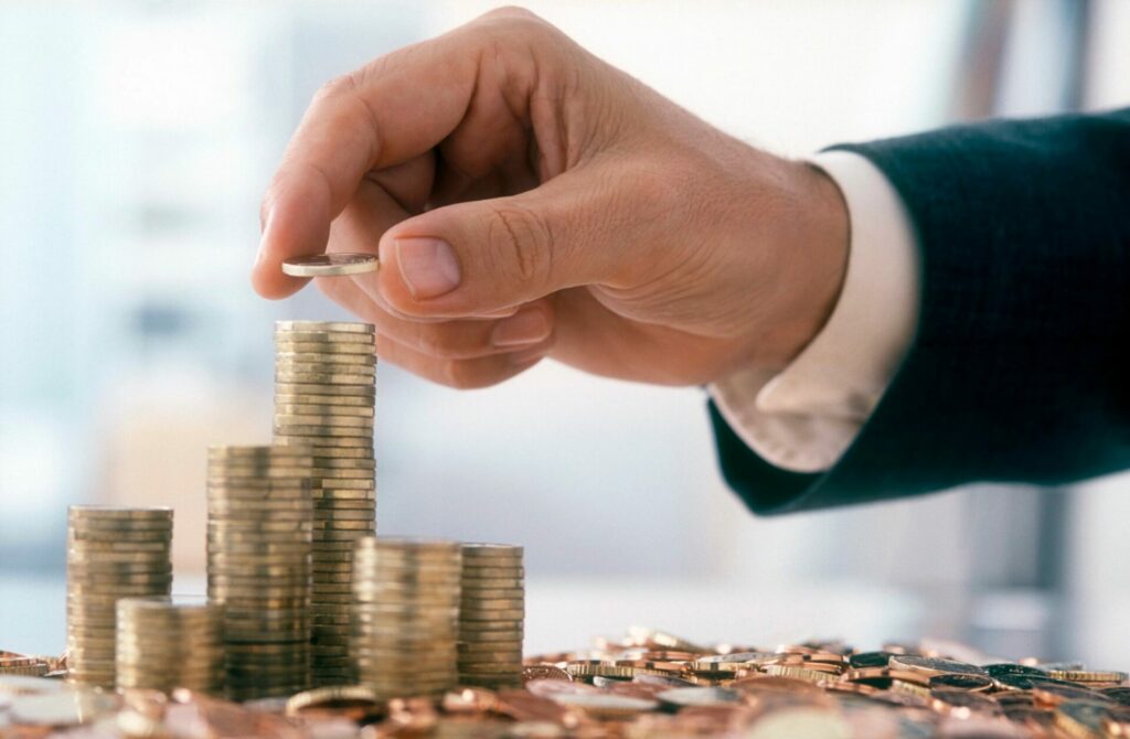 man stacking money for gas and electricity savings